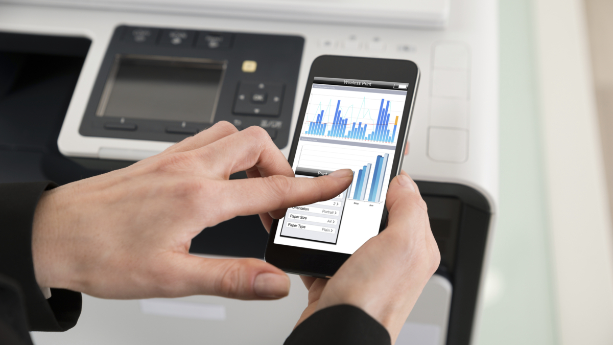 Close-up Of Businesswoman Giving Print Command On Smart Phone